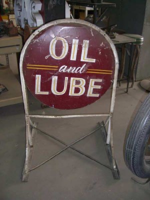 Freestanding, double sided sign. "Oil and Lube" one one side, "Mechanic on Duty" on the other side.