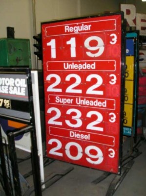 Red, gas prices sign.