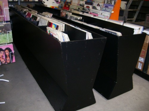 Wooden Hourglass Shaped Record Racks.