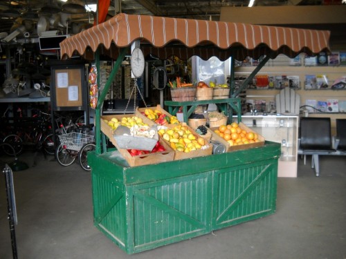 Green Rolling Wooden Produce Stand with Brown Awning