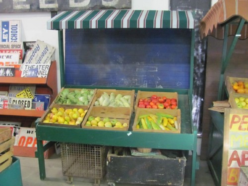 Green Wooden Produce Stand with Green Awning