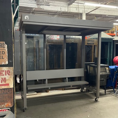 Large, Light Gray Bus Stop Enclosure