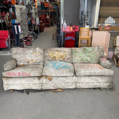 Aged Fabric Couch with Graffiti