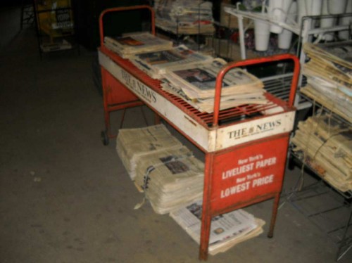 Newspaper Rack- orange metal wire